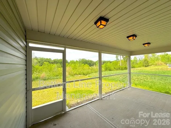 a view of an empty room with a large window