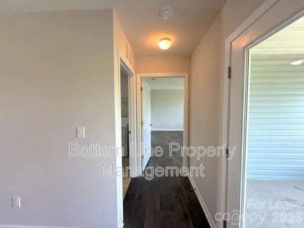 a view of a bedroom from a hallway