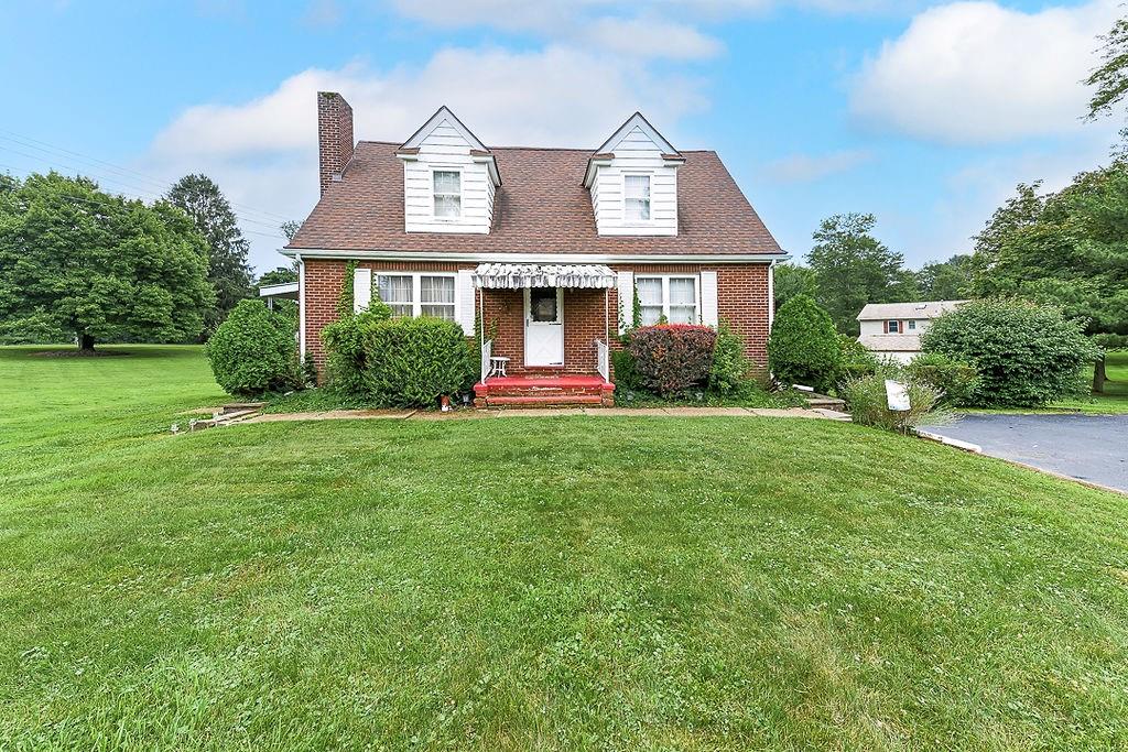 4515 Tuscarawas Road Beaver, PA 15009 - Photo 2 of 50 a front view of a house with a yard