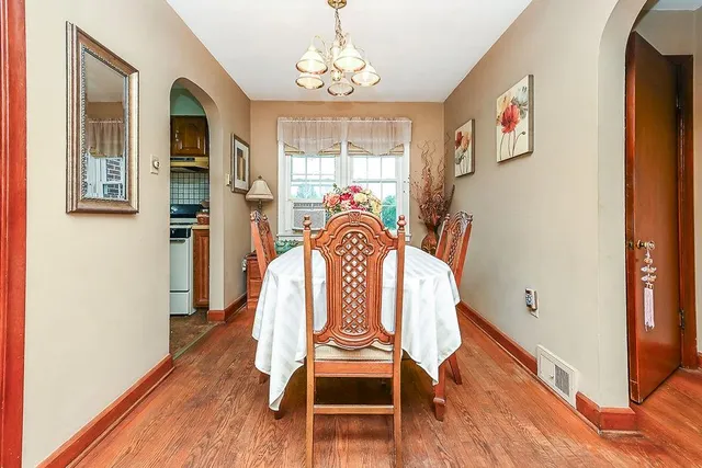 a view of a dining room with furniture window and wooden floor