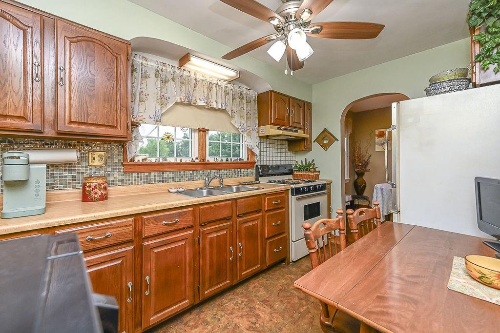 4515 Tuscarawas Road Beaver, PA 15009 - Photo 25 of 50 a kitchen with stainless steel appliances granite countertop a sink a stove cabinets counter space and stainless steel appliances