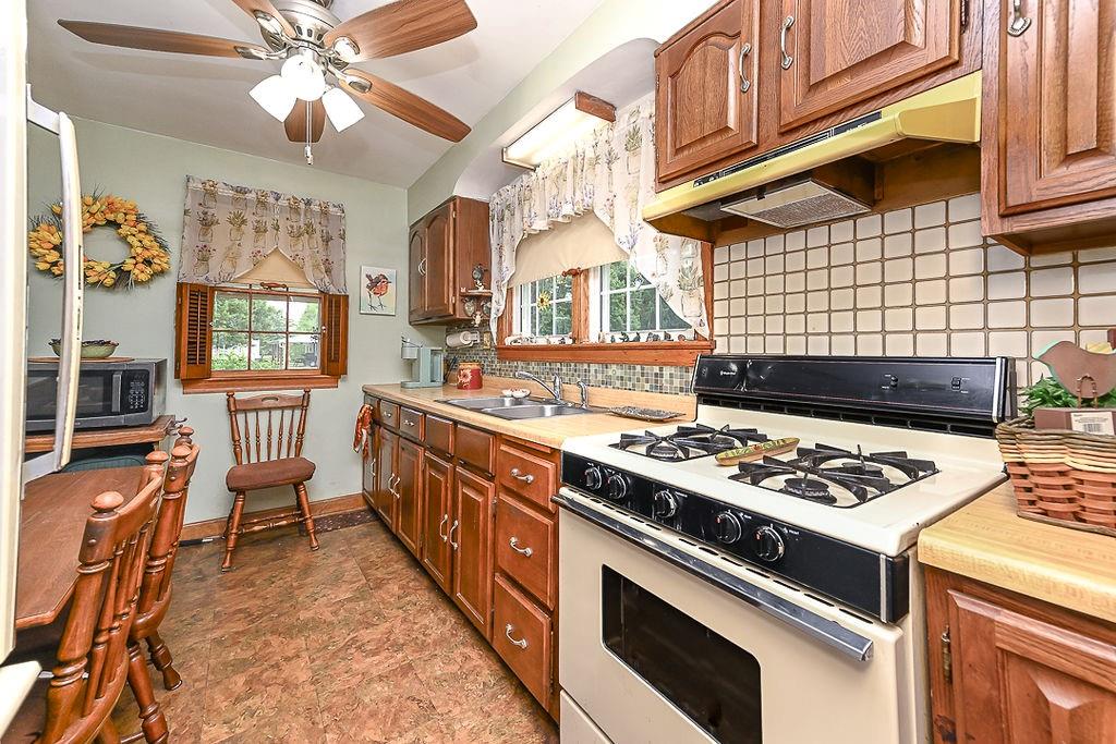 4515 Tuscarawas Road Beaver, PA 15009 - Photo 27 of 50 a kitchen with a stove and a sink