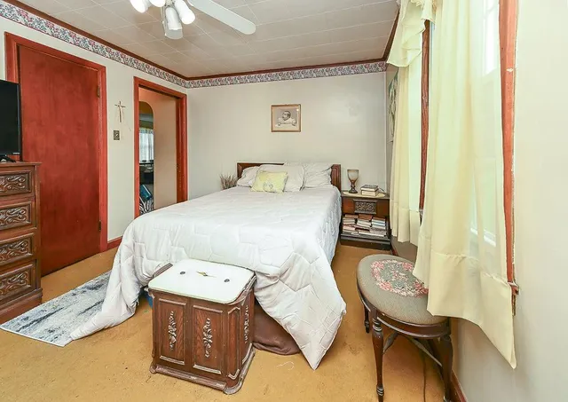 a bedroom with a bed and furniture