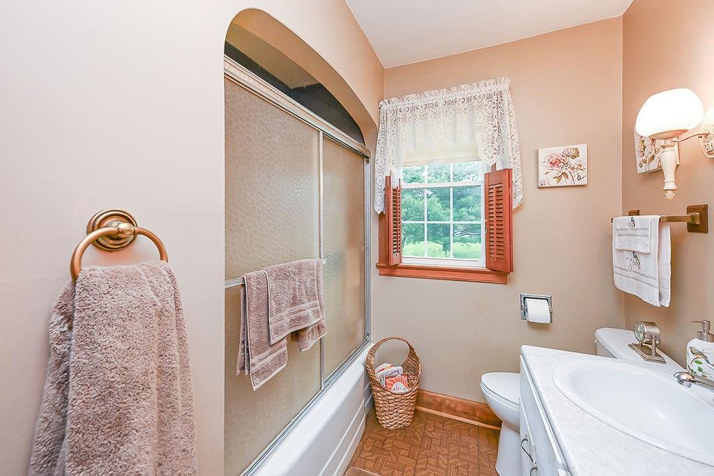 4515 Tuscarawas Road Beaver, PA 15009 - Photo 35 of 50 a bathroom with a sink a toilet and a mirror