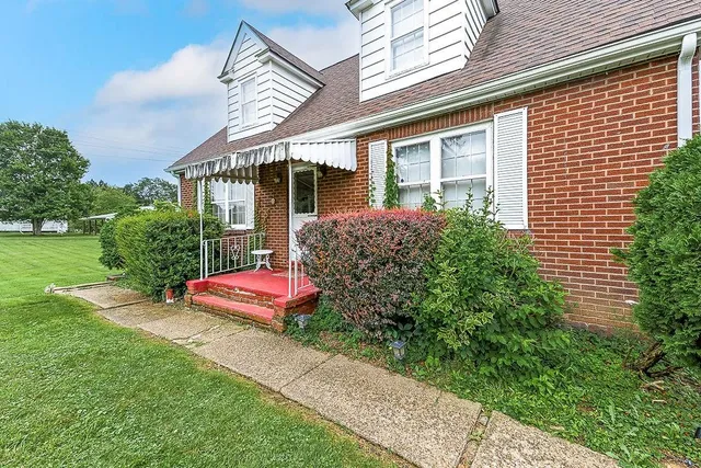 a front view of a house with garden