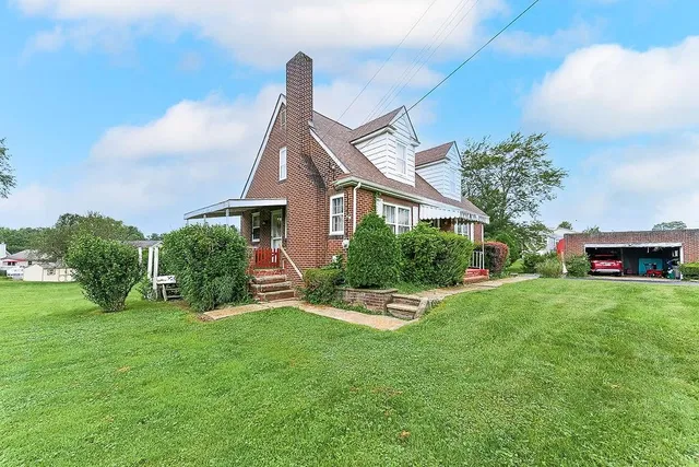 a front view of a house with garden