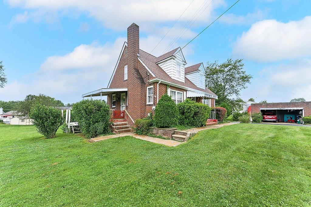 4515 Tuscarawas Road Beaver, PA 15009 - Photo 7 of 50 a front view of a house with garden