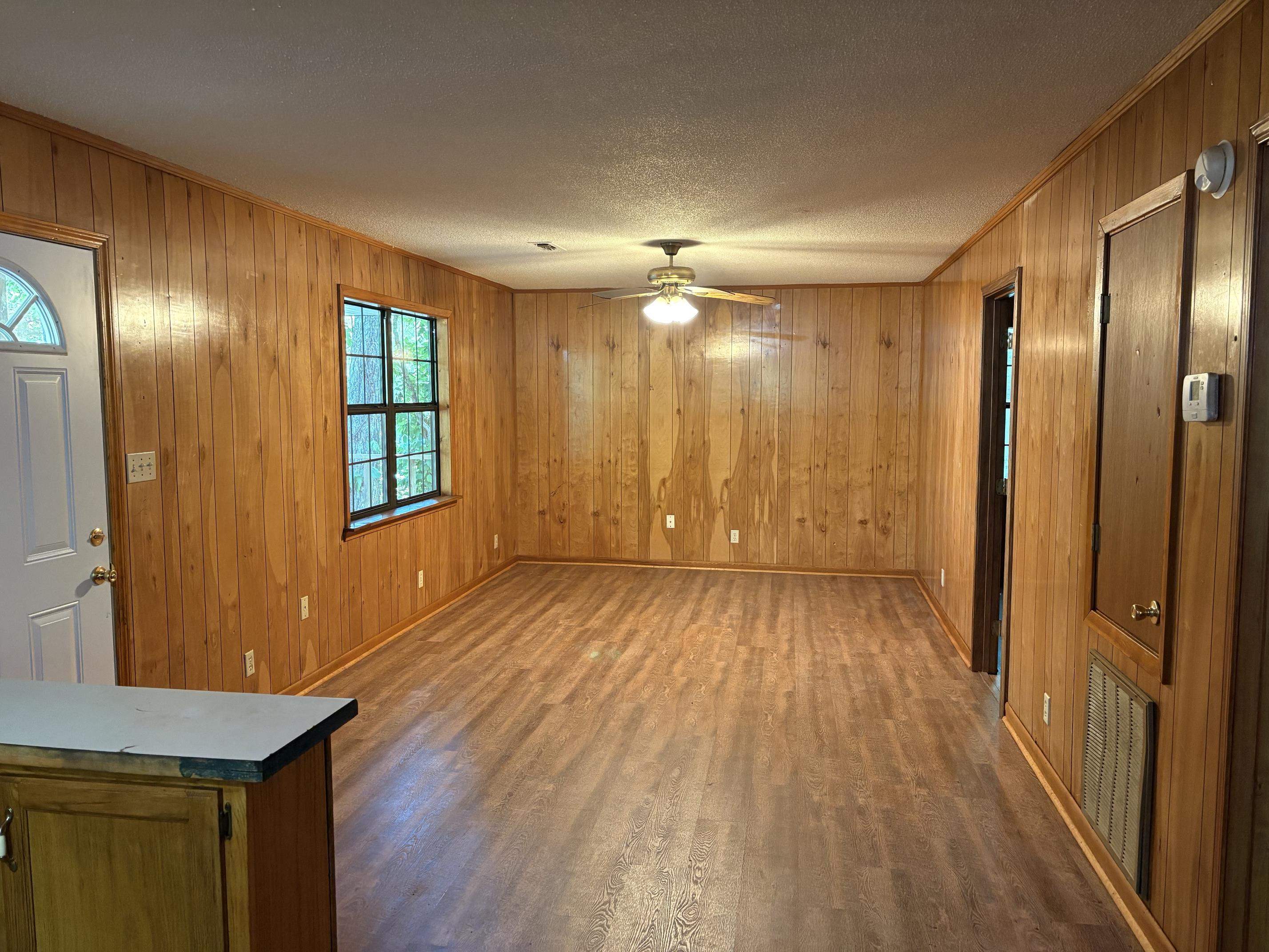 146 Walker Street Ripley, TN 38063 - Photo 6 of 14 a view of a room with wooden floor and windows