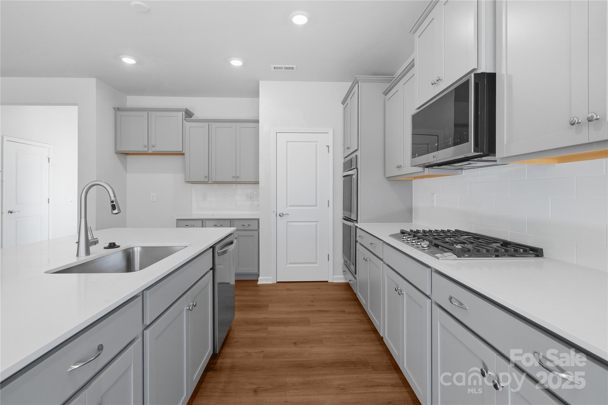 3322 Amarillo Court Lancaster, SC 29720 - Photo 12 of 30 a kitchen with stainless steel appliances granite countertop a sink and a stove top oven