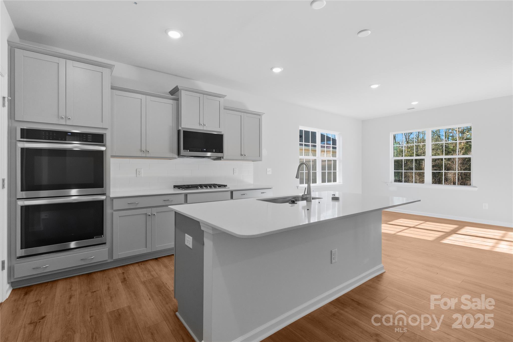 3322 Amarillo Court Lancaster, SC 29720 - Photo 17 of 30 a kitchen with sink cabinets and stainless steel appliances