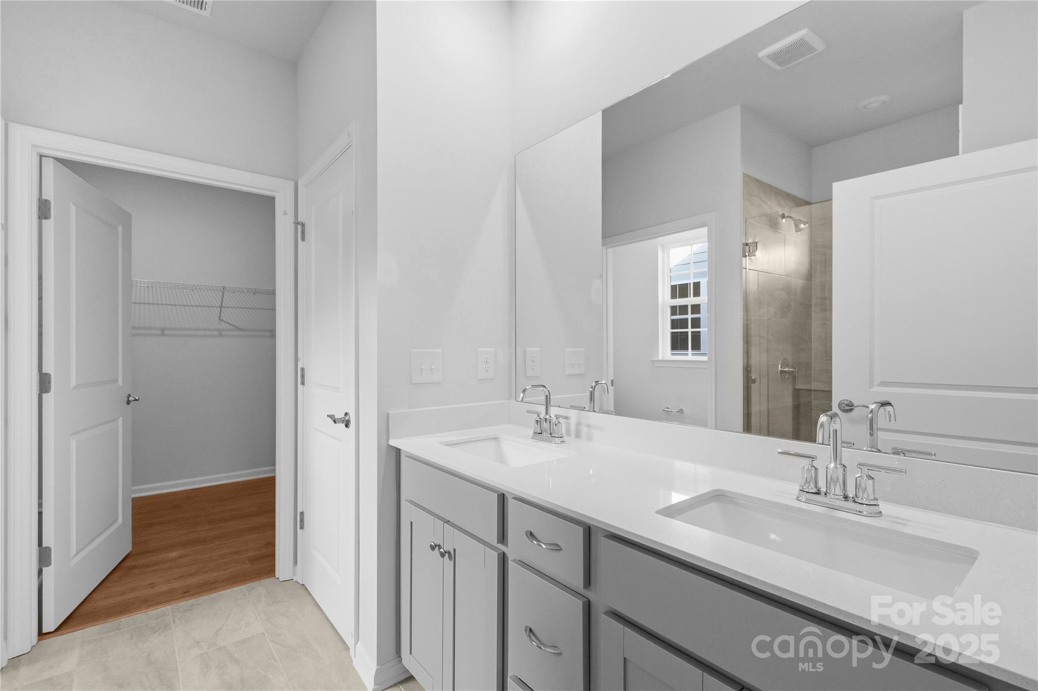 3322 Amarillo Court Lancaster, SC 29720 - Photo 25 of 30 a bathroom with a double vanity sink and a mirror