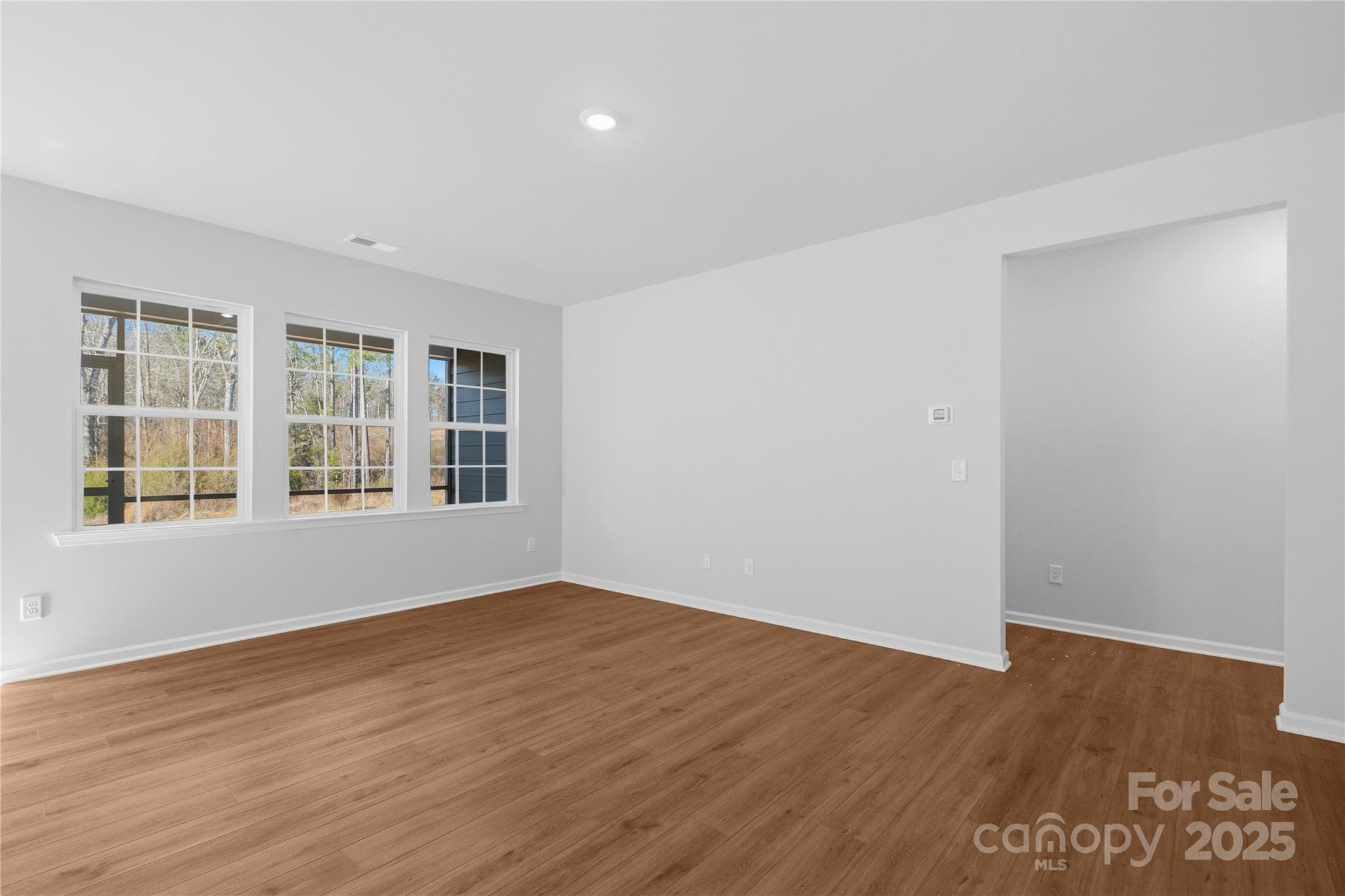 3322 Amarillo Court Lancaster, SC 29720 - Photo 6 of 30 a view of empty room with wooden floor and fan