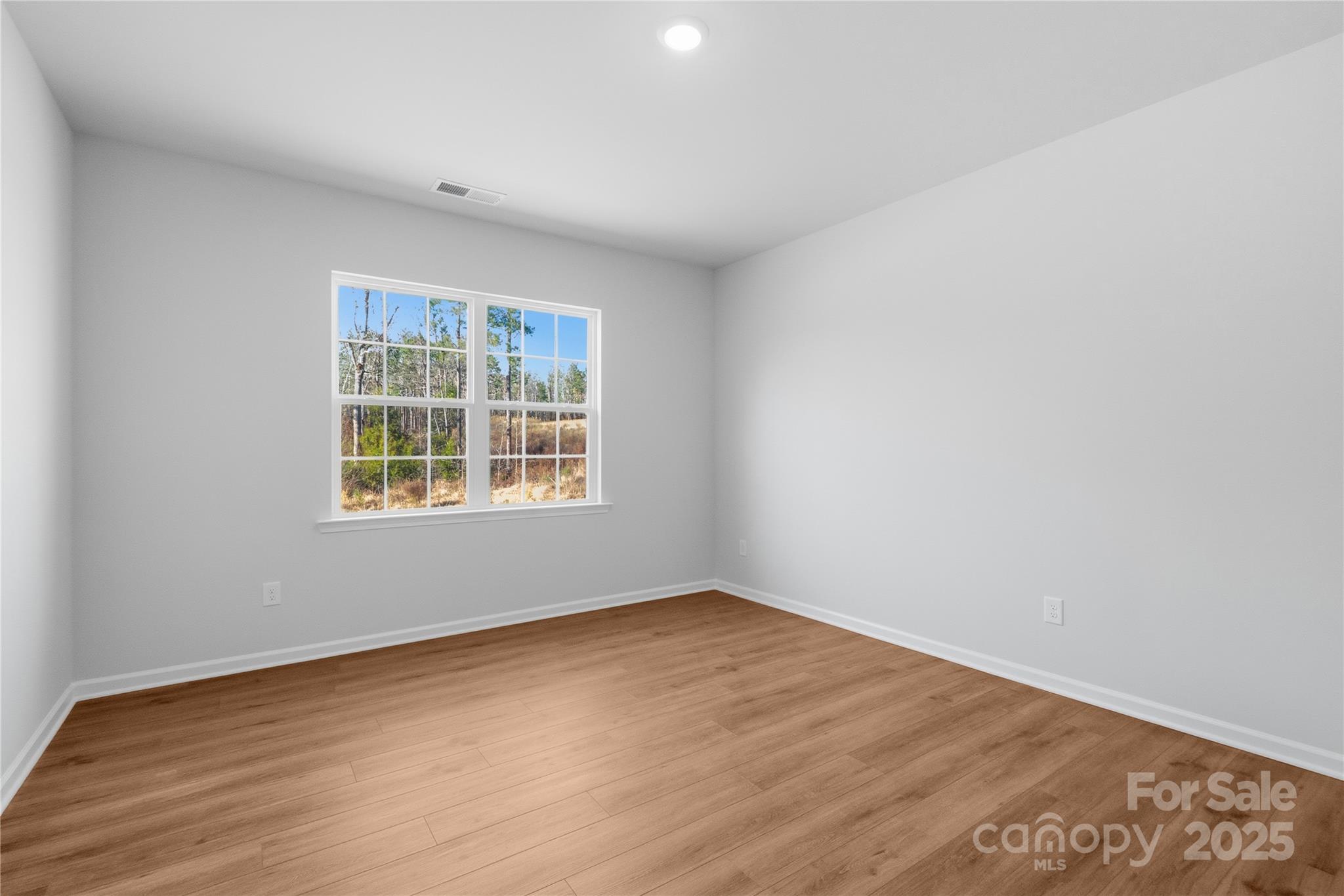 3322 Amarillo Court Lancaster, SC 29720 - Photo 8 of 30 wooden floor in an empty room with a window