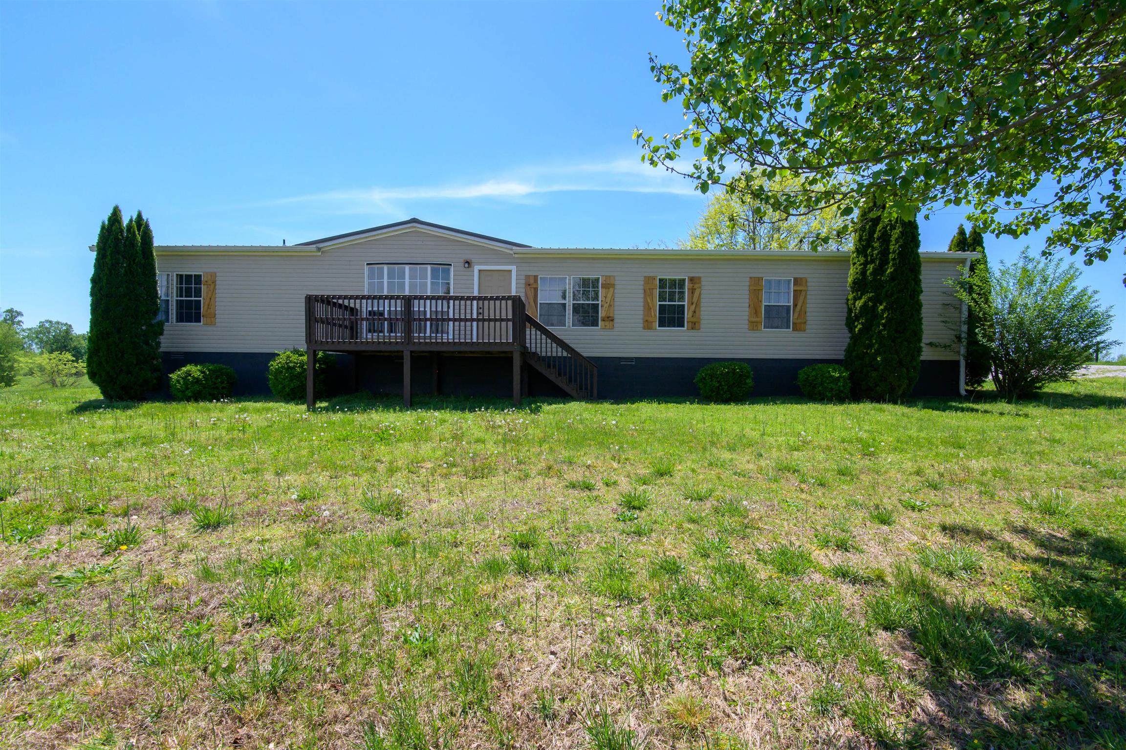 4489 Goodman Road Adams, TN 37010 - Photo 1 of 30 a house view with a garden space