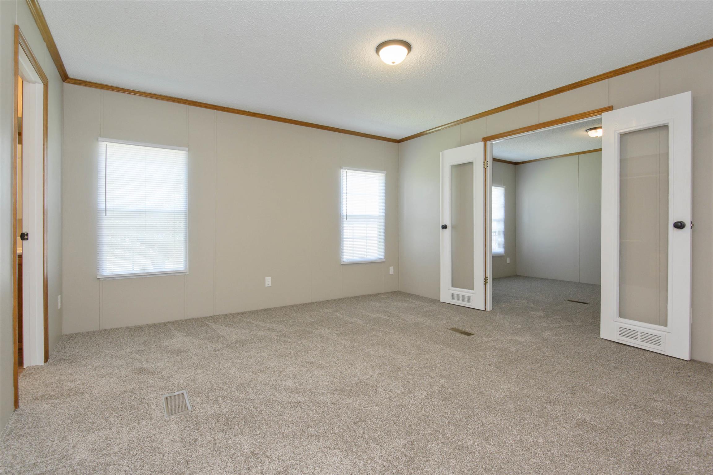 4489 Goodman Road Adams, TN 37010 - Photo 20 of 30 an empty room with windows and closet