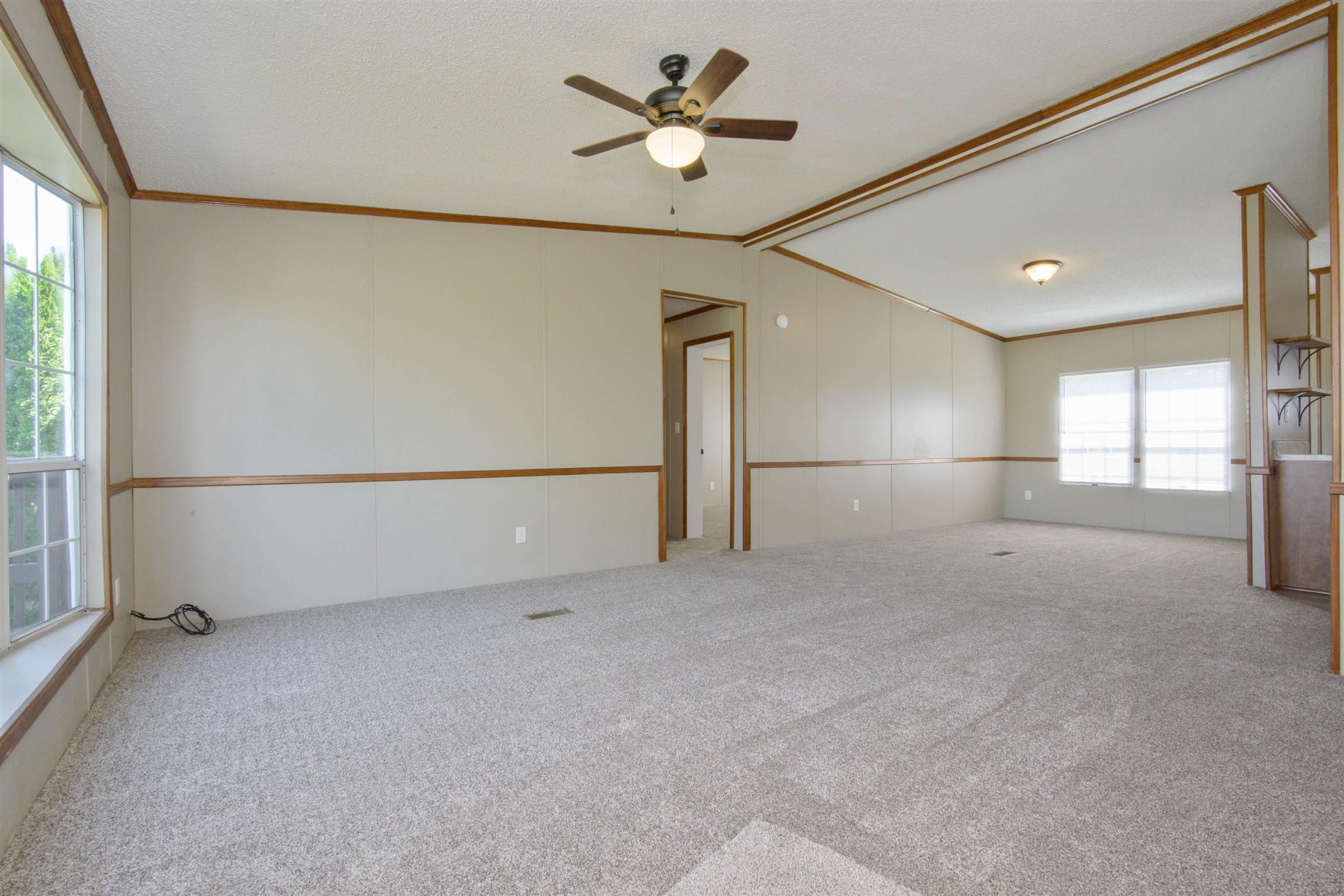 4489 Goodman Road Adams, TN 37010 - Photo 3 of 30 a view of a livingroom with a ceiling fan and window