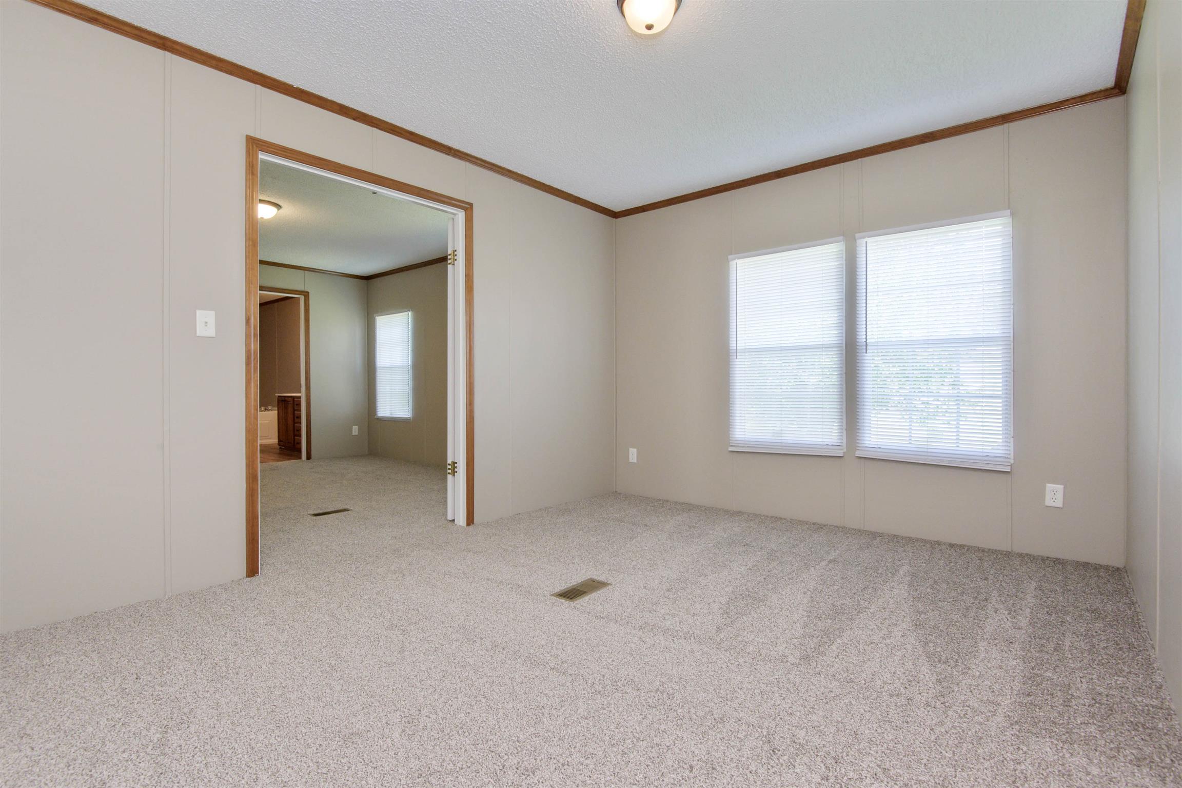 4489 Goodman Road Adams, TN 37010 - Photo 21 of 30 an empty room with windows and entrance