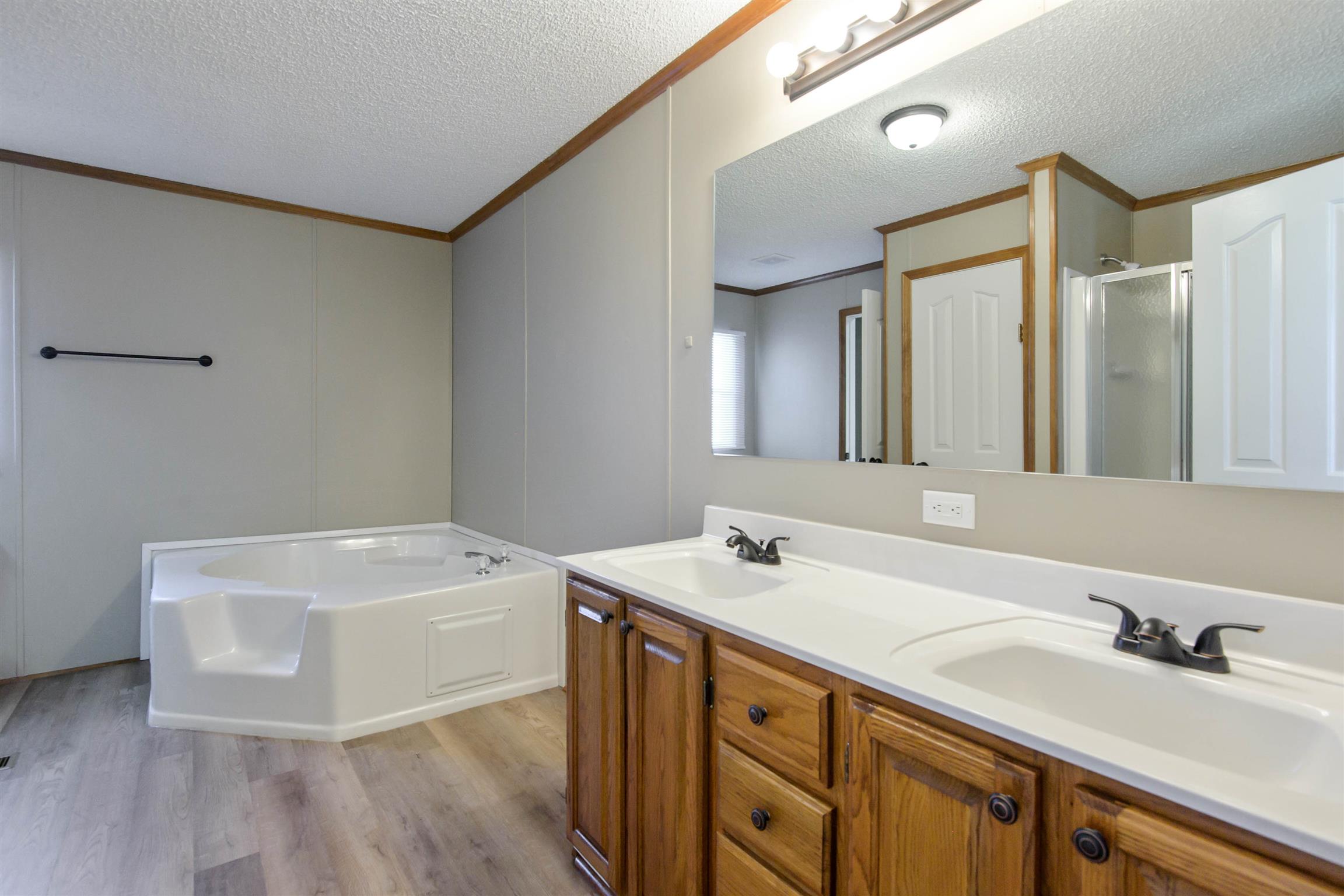 4489 Goodman Road Adams, TN 37010 - Photo 23 of 30 a bathroom with a sink and a mirror