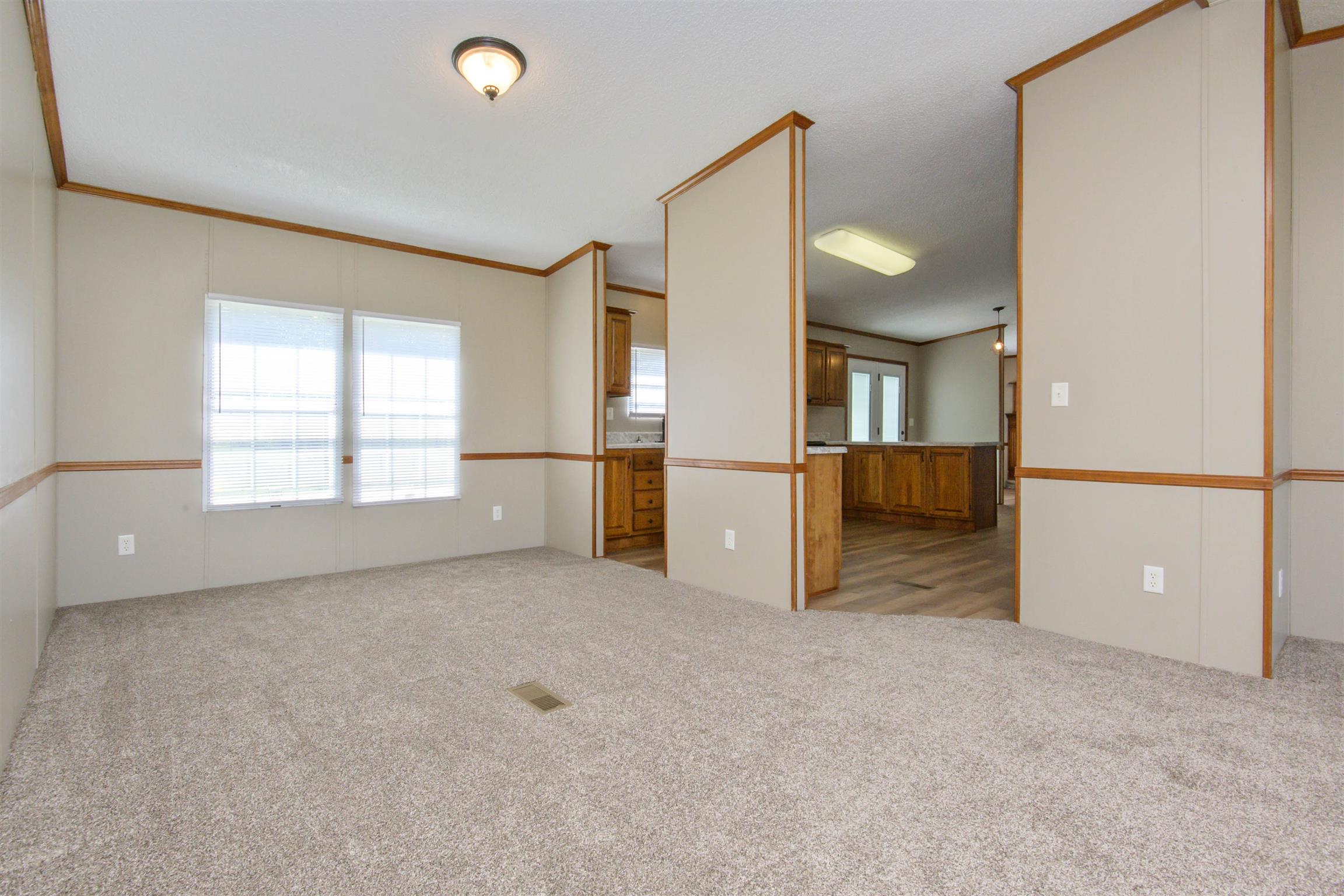 4489 Goodman Road Adams, TN 37010 - Photo 5 of 30 an empty room with windows and entrance