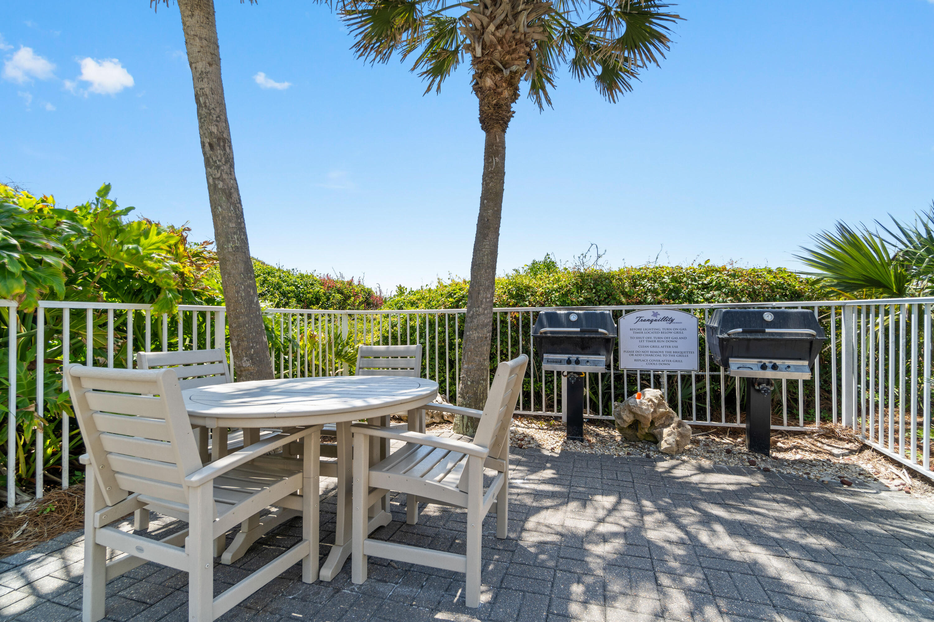32461 East County Highway 30A, Unit 330 Inlet Beach, FL 32461 - Photo 31 of 31 a view of a patio with a table chairs and a table