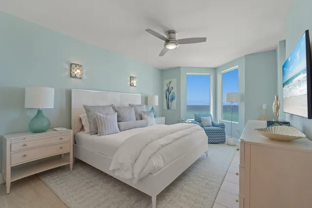 a bedroom with a large bed and a window