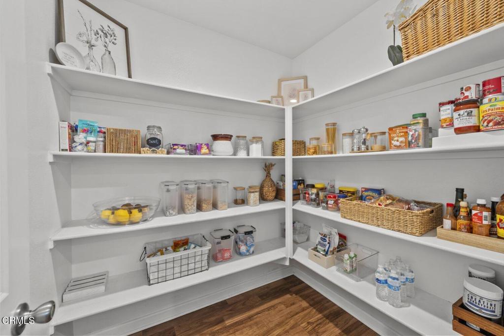 586 Apricot Lane Fillmore, CA 93015 - Photo 11 of 38 a cabinet with granite countertop lots of different kinds of food