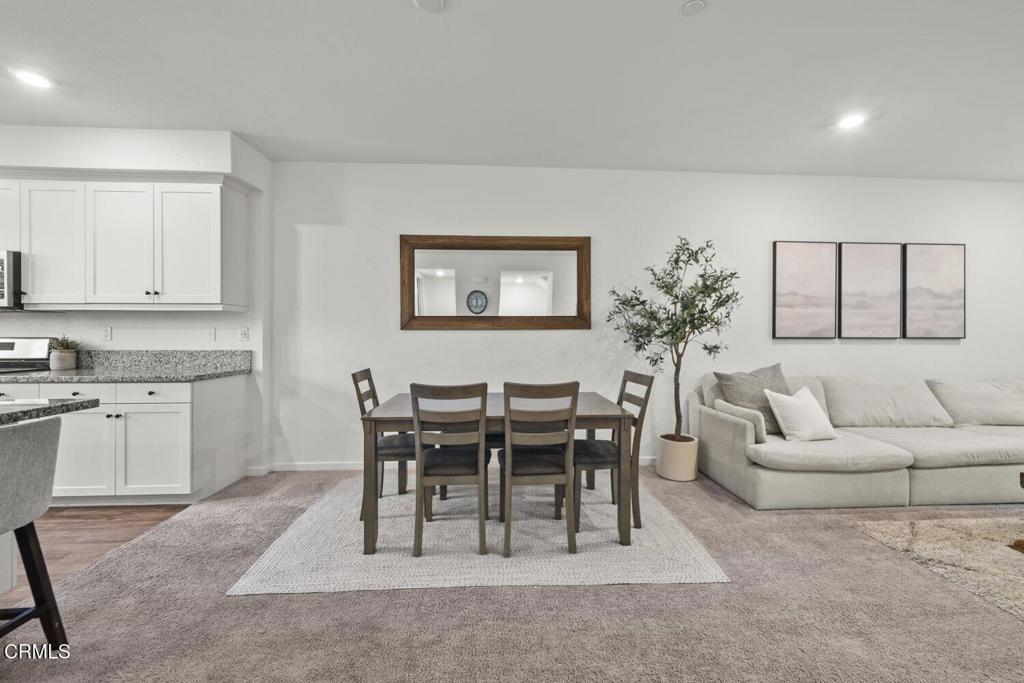 586 Apricot Lane Fillmore, CA 93015 - Photo 12 of 38 a living room with furniture a dining table and kitchen view