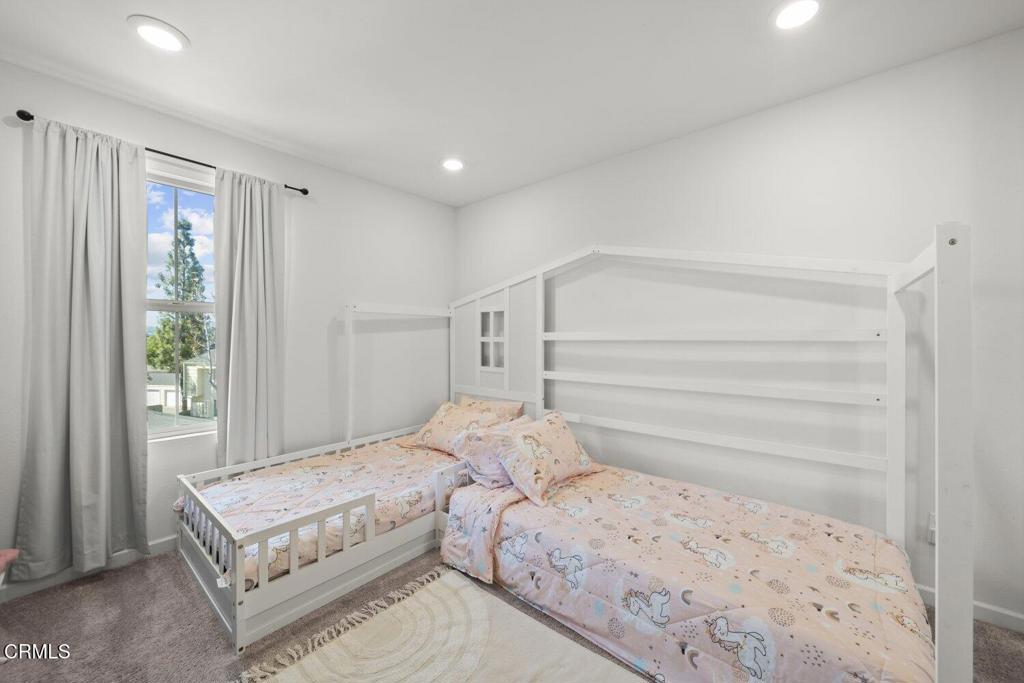 586 Apricot Lane Fillmore, CA 93015 - Photo 20 of 38 a bedroom with a large bed and a window