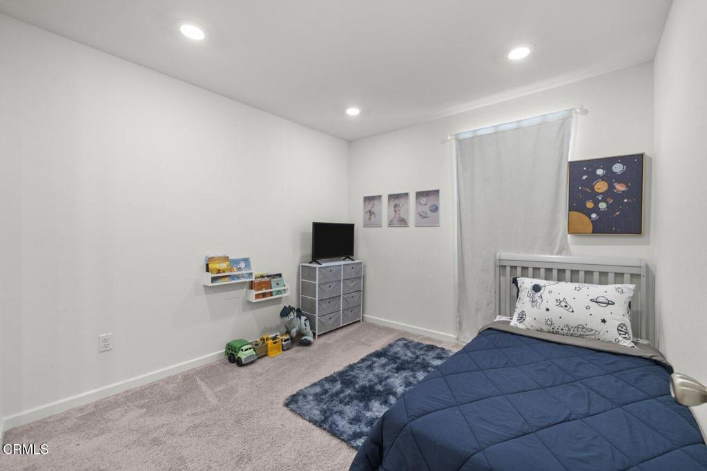 586 Apricot Lane Fillmore, CA 93015 - Photo 23 of 38 a bedroom with a bed and furniture