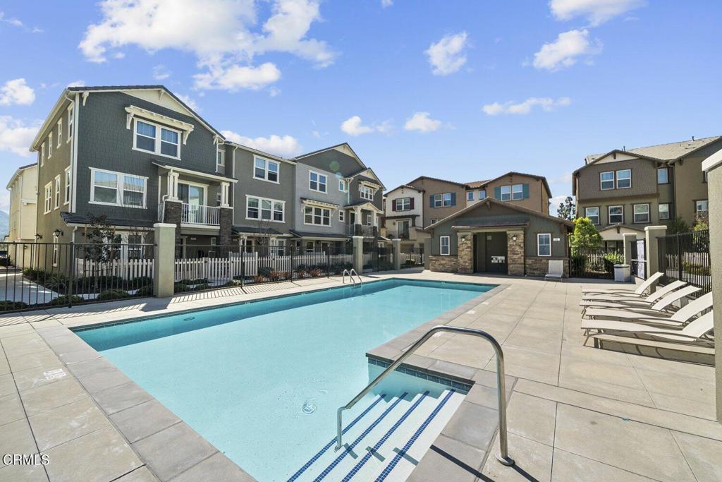 586 Apricot Lane Fillmore, CA 93015 - Photo 32 of 38 a front view of a residential apartment building with a yard