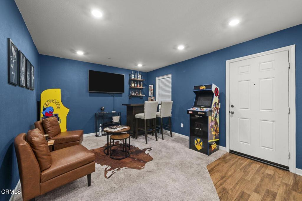 586 Apricot Lane Fillmore, CA 93015 - Photo 5 of 38 a living room with furniture a flat screen tv and a refrigerator
