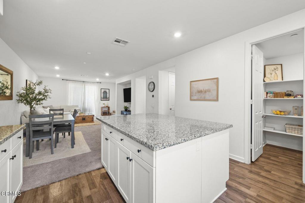 586 Apricot Lane Fillmore, CA 93015 - Photo 10 of 38 a kitchen with center island table and chairs