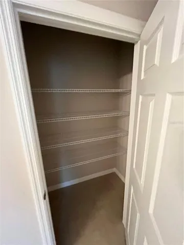 a view of an empty walk in closet