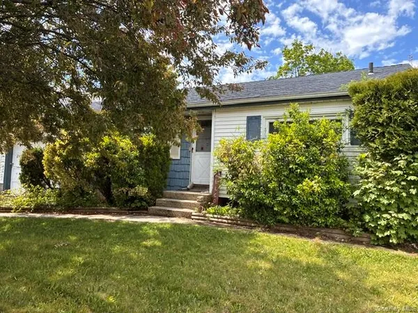 a view of backyard with a garden and entertaining space