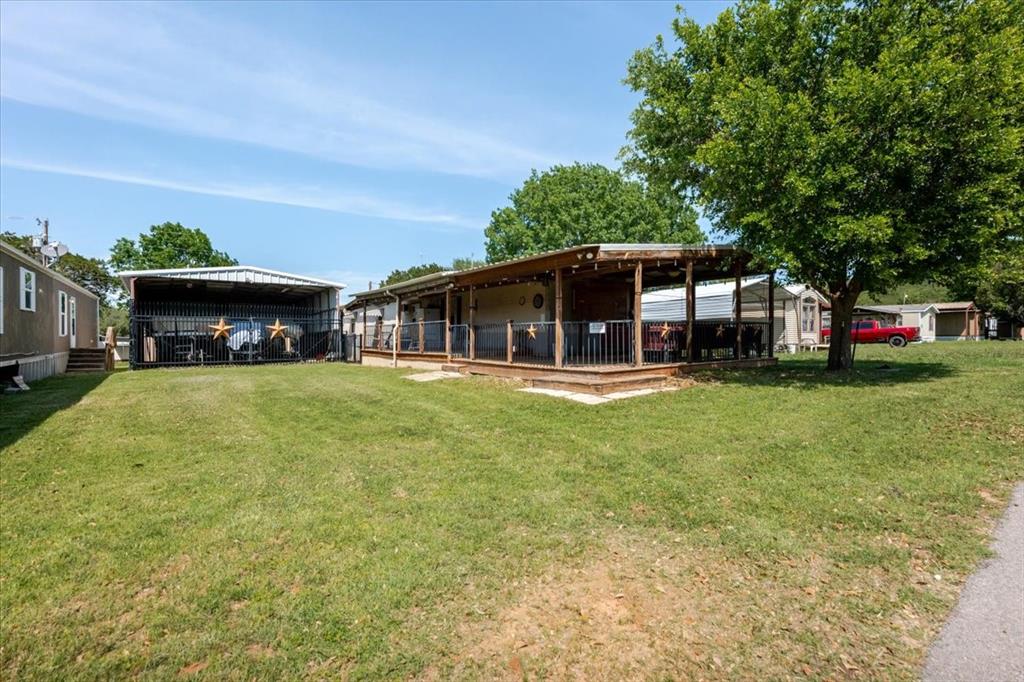 Fabulous porch and Carport for boat and golfcarts etc.