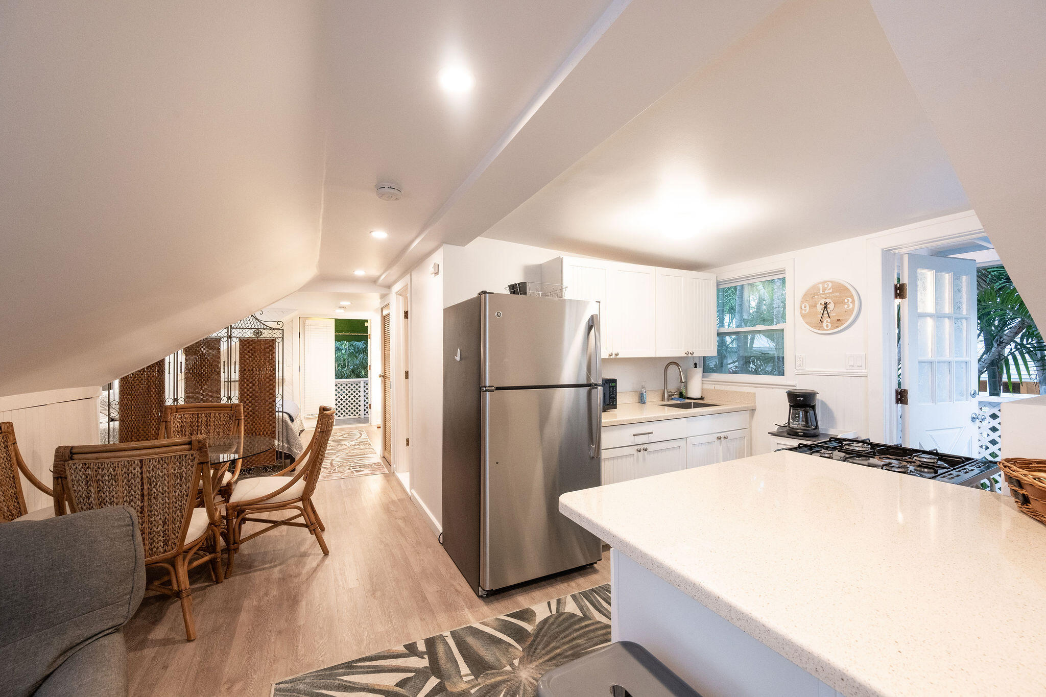 1209 Pearl Street Key West, FL 33040 - Photo 21 of 22 a kitchen with stainless steel appliances a refrigerator and a stove top oven