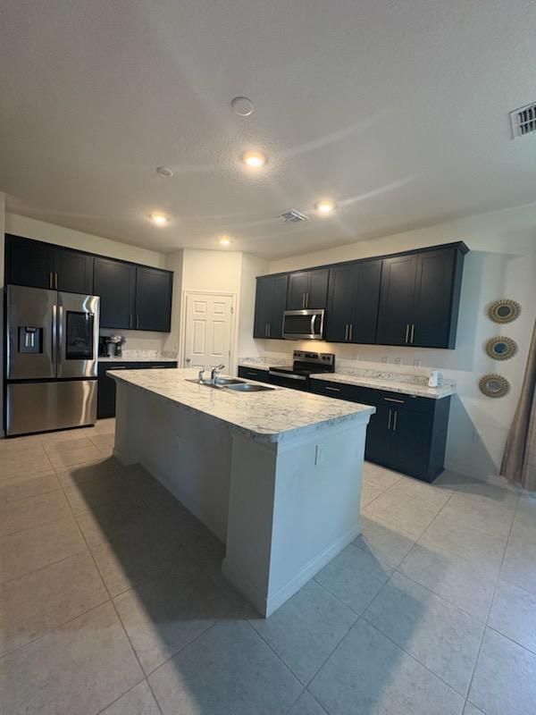 3982 Southwest Halcomb Street Port St. Lucie, FL 34953 - Photo 12 of 13 KITCHEN SHOWING APPLIANCES