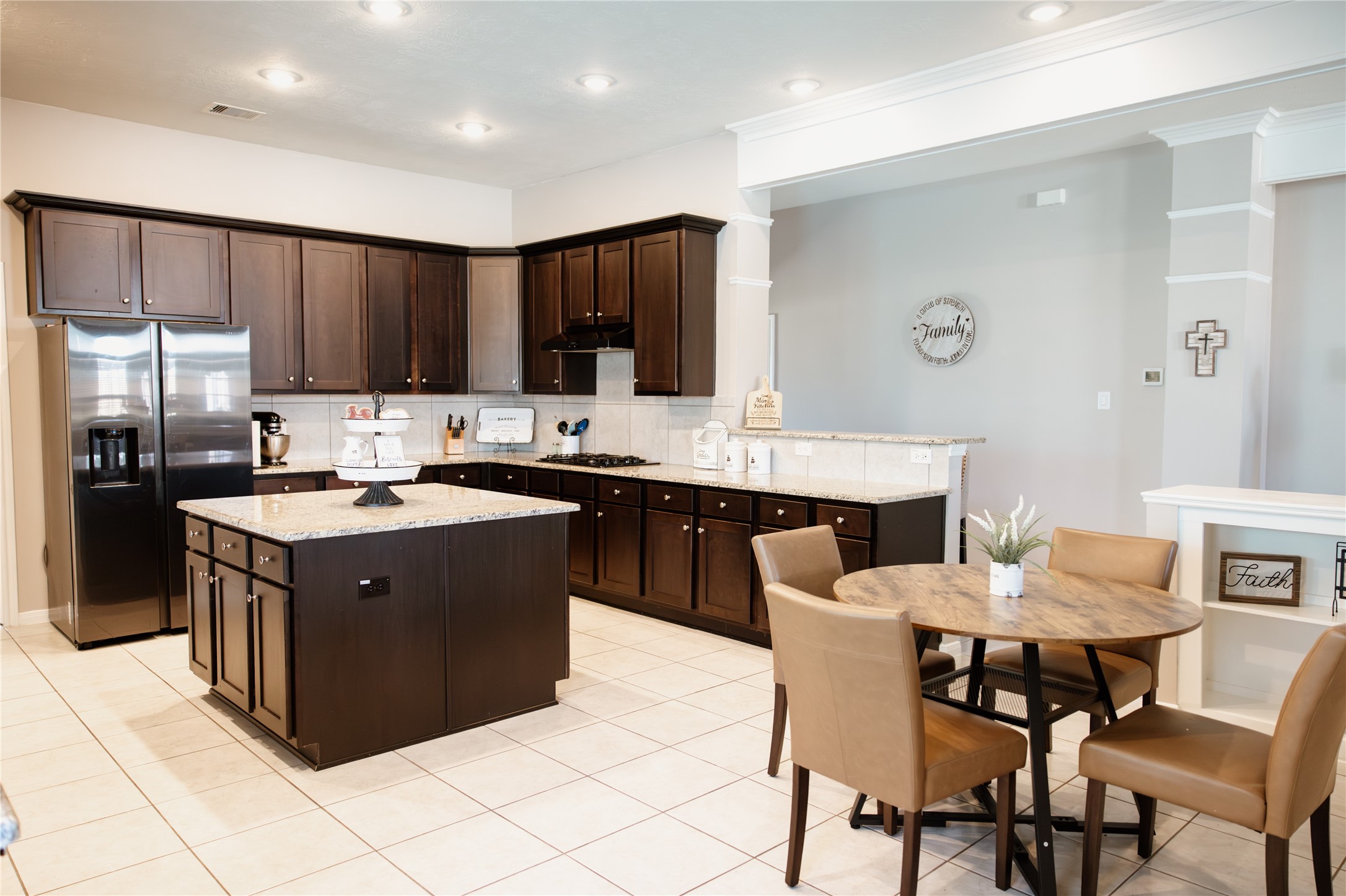 6438 Grapevine Bend Manvel, TX 77578 - Photo 2 of 36 Generous Cabinetry throughout this elegant kitchen for optimal organization with breakfast area and spacious Island