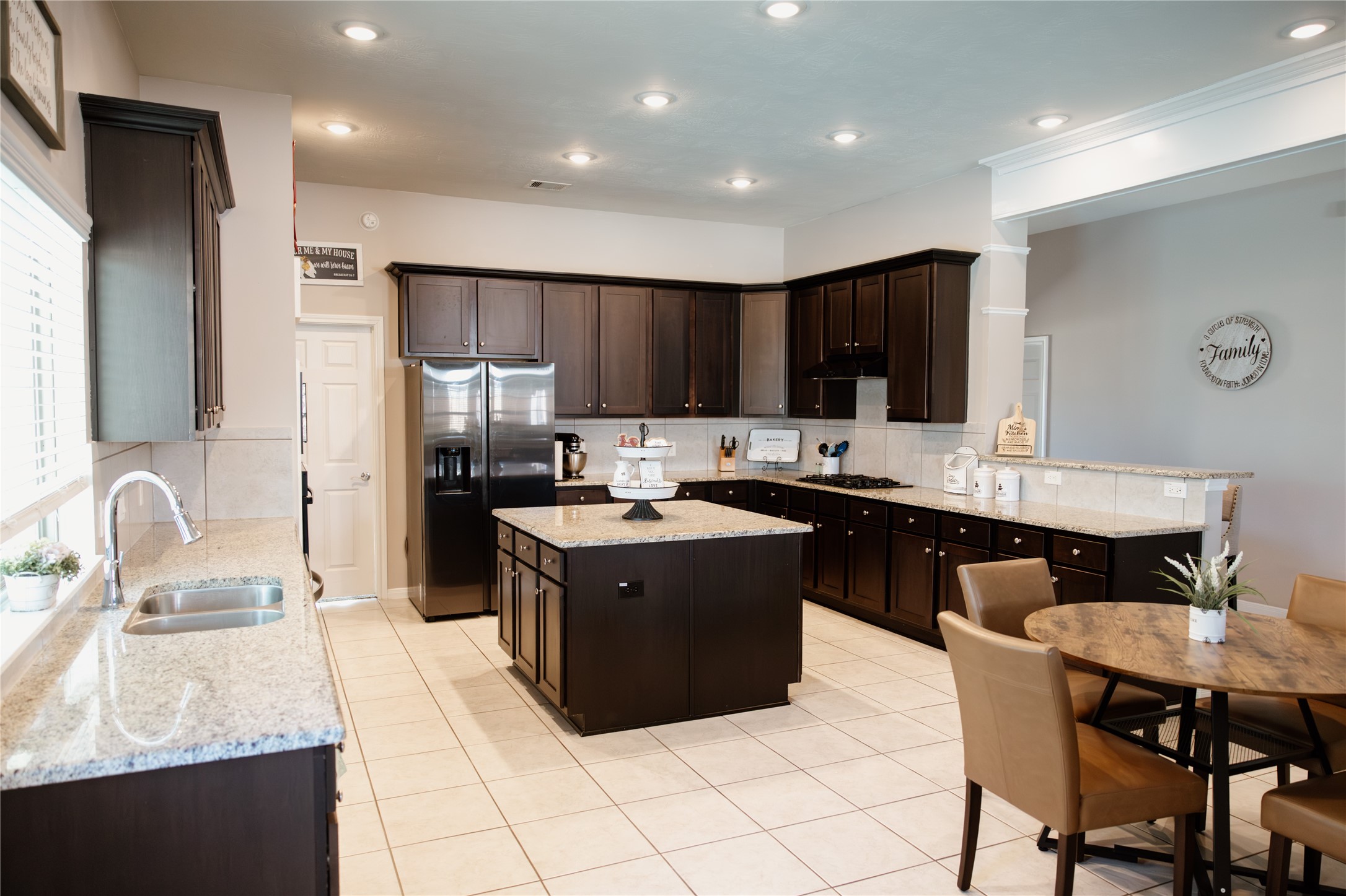 6438 Grapevine Bend Manvel, TX 77578 - Photo 3 of 36 Generous Cabinetry throughout this elegant kitchen for optimal organization with breakfast area and spacious Island