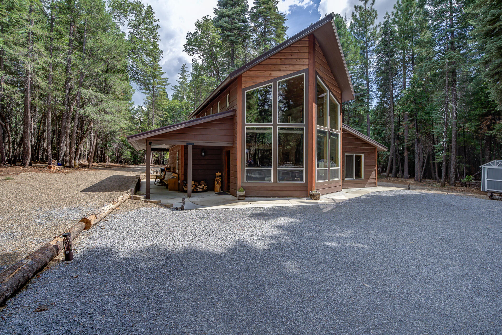 34607 Mountain Haven Road Shingletown, CA 96088 - Photo 1 of 63 a view of a house with a yard and large trees