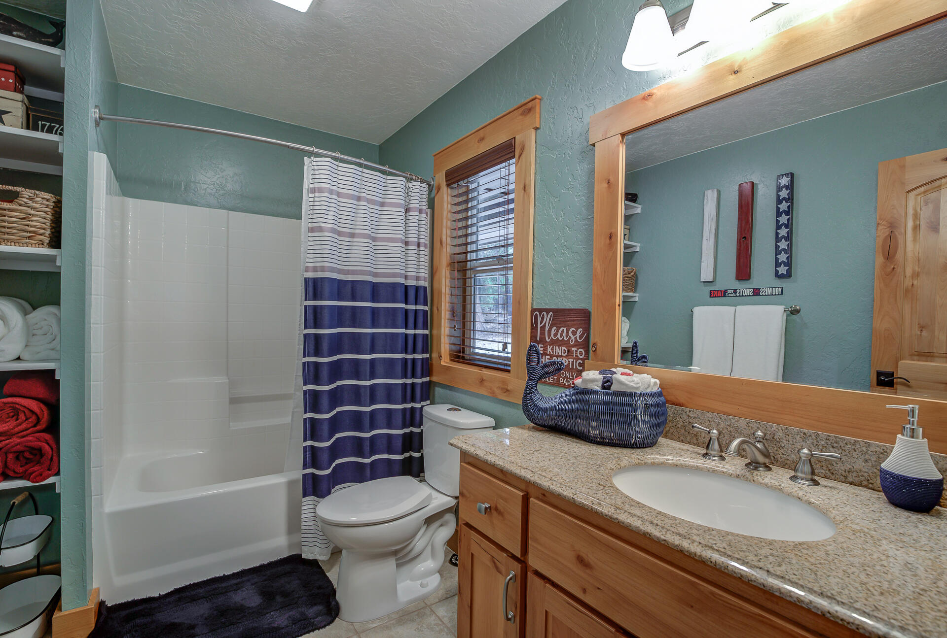 34607 Mountain Haven Road Shingletown, CA 96088 - Photo 21 of 63 a bathroom with a granite countertop sink toilet mirror and shower