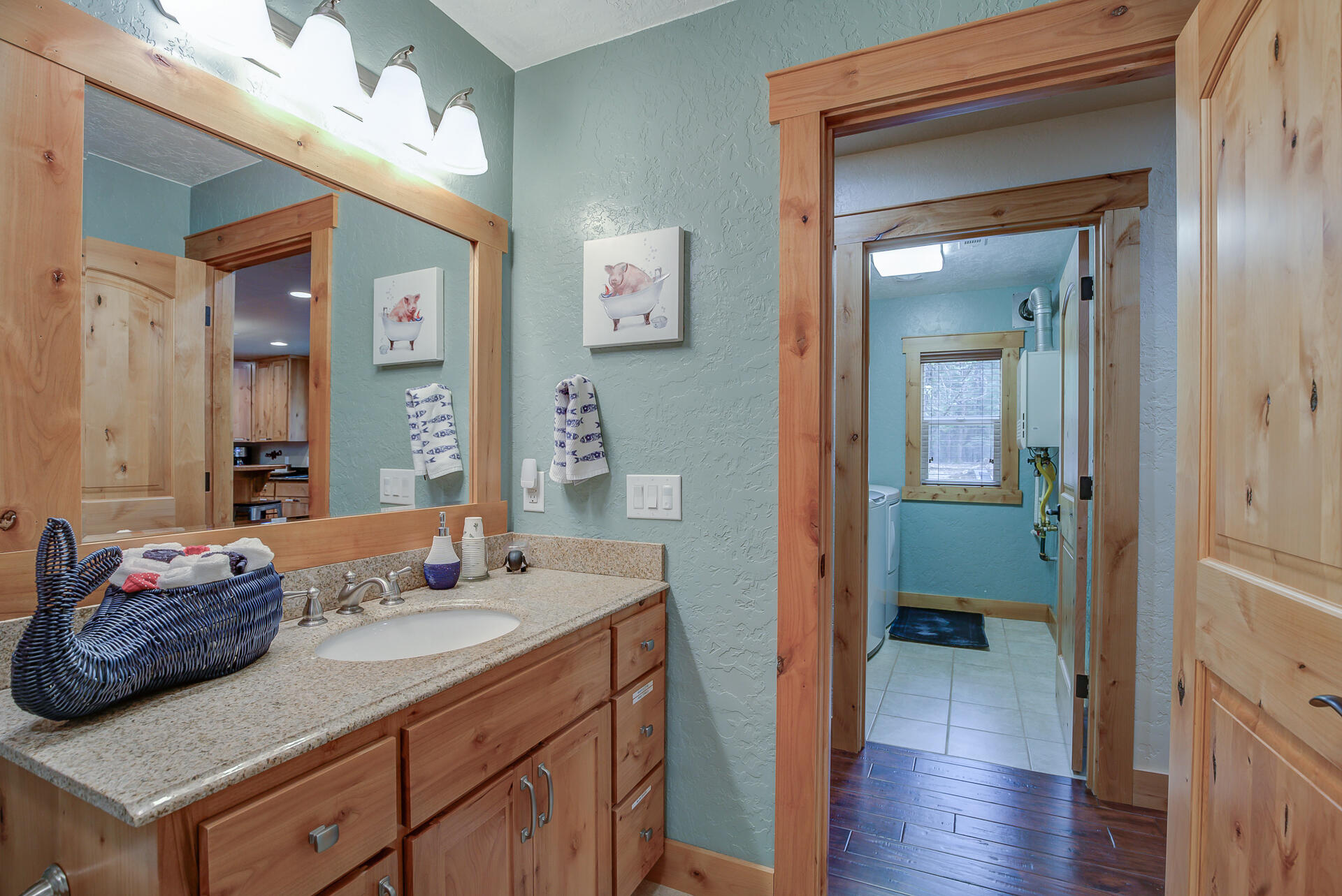 34607 Mountain Haven Road Shingletown, CA 96088 - Photo 22 of 63 a en suite bathroom with a granite countertop sink and a mirror