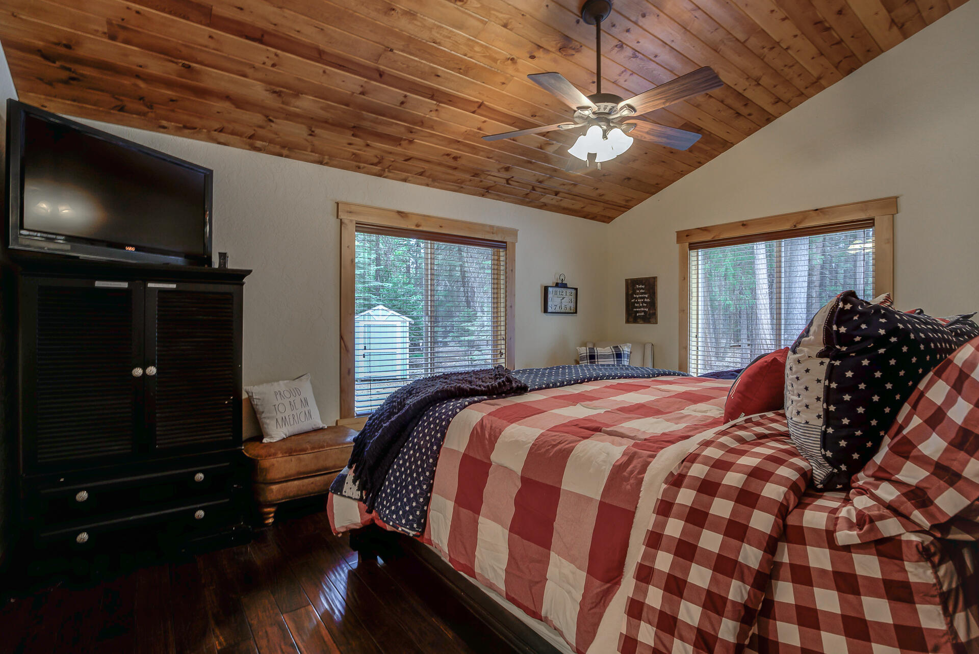 34607 Mountain Haven Road Shingletown, CA 96088 - Photo 25 of 63 a bedroom with a bed and a chandelier