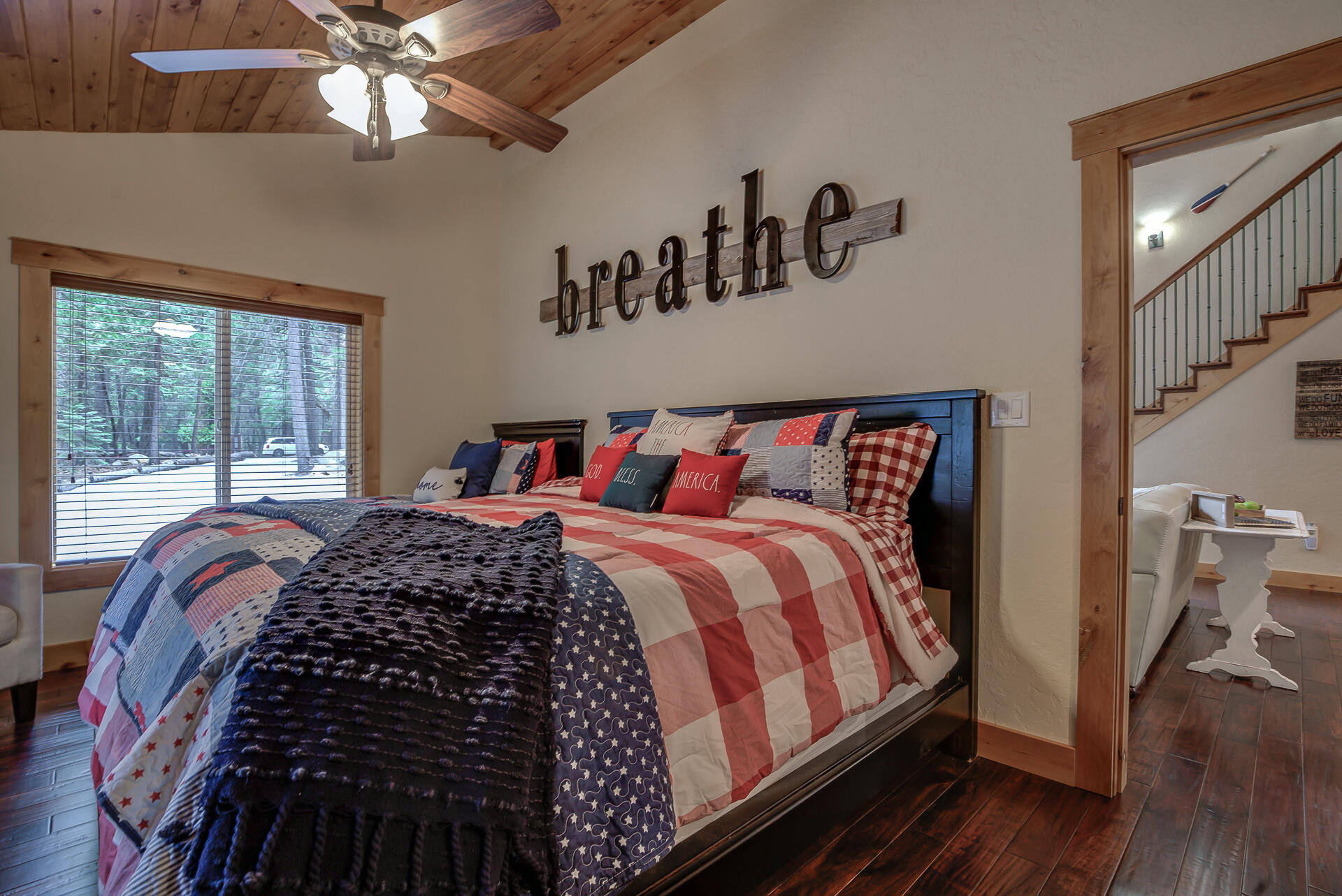 34607 Mountain Haven Road Shingletown, CA 96088 - Photo 27 of 63 a bed sitting in a bedroom next to a window