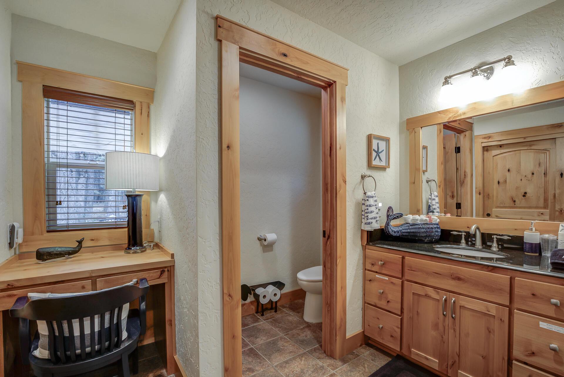 34607 Mountain Haven Road Shingletown, CA 96088 - Photo 30 of 63 a en suite bathroom with a granite countertop sink and a mirror