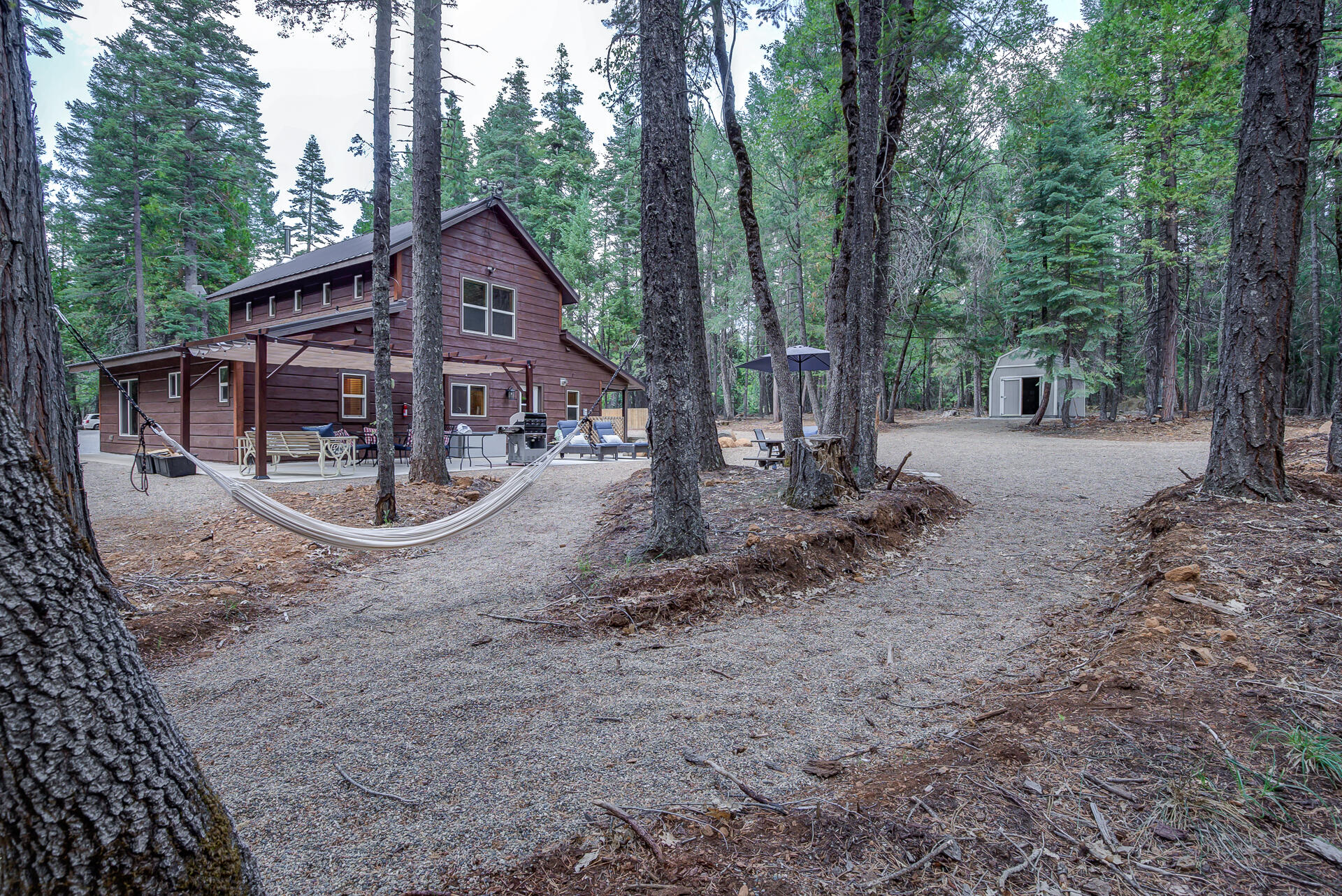 34607 Mountain Haven Road Shingletown, CA 96088 - Photo 42 of 63 a view of a house with a yard covered in snow