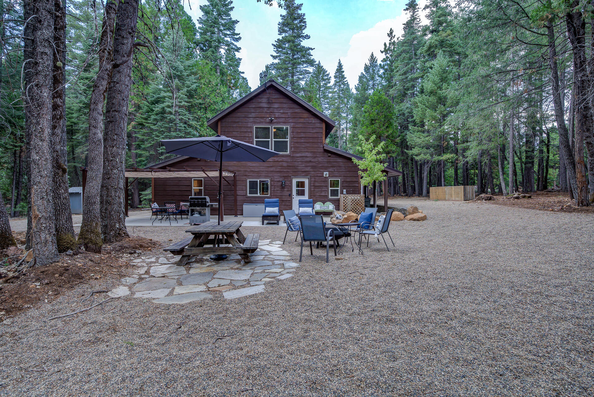 34607 Mountain Haven Road Shingletown, CA 96088 - Photo 43 of 63 a view of a house with a yard and sitting area