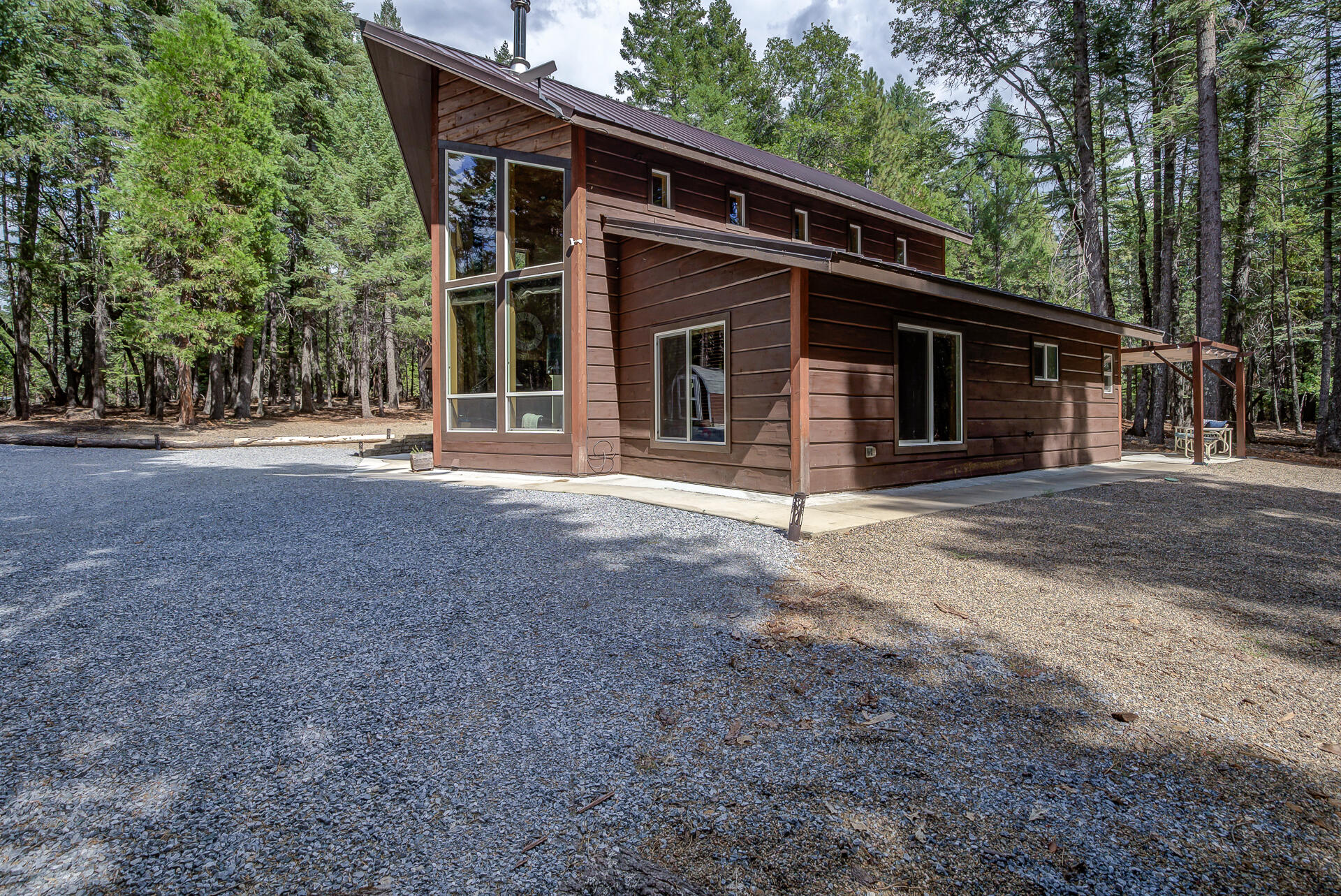 34607 Mountain Haven Road Shingletown, CA 96088 - Photo 55 of 63 a front view of a house with a porch