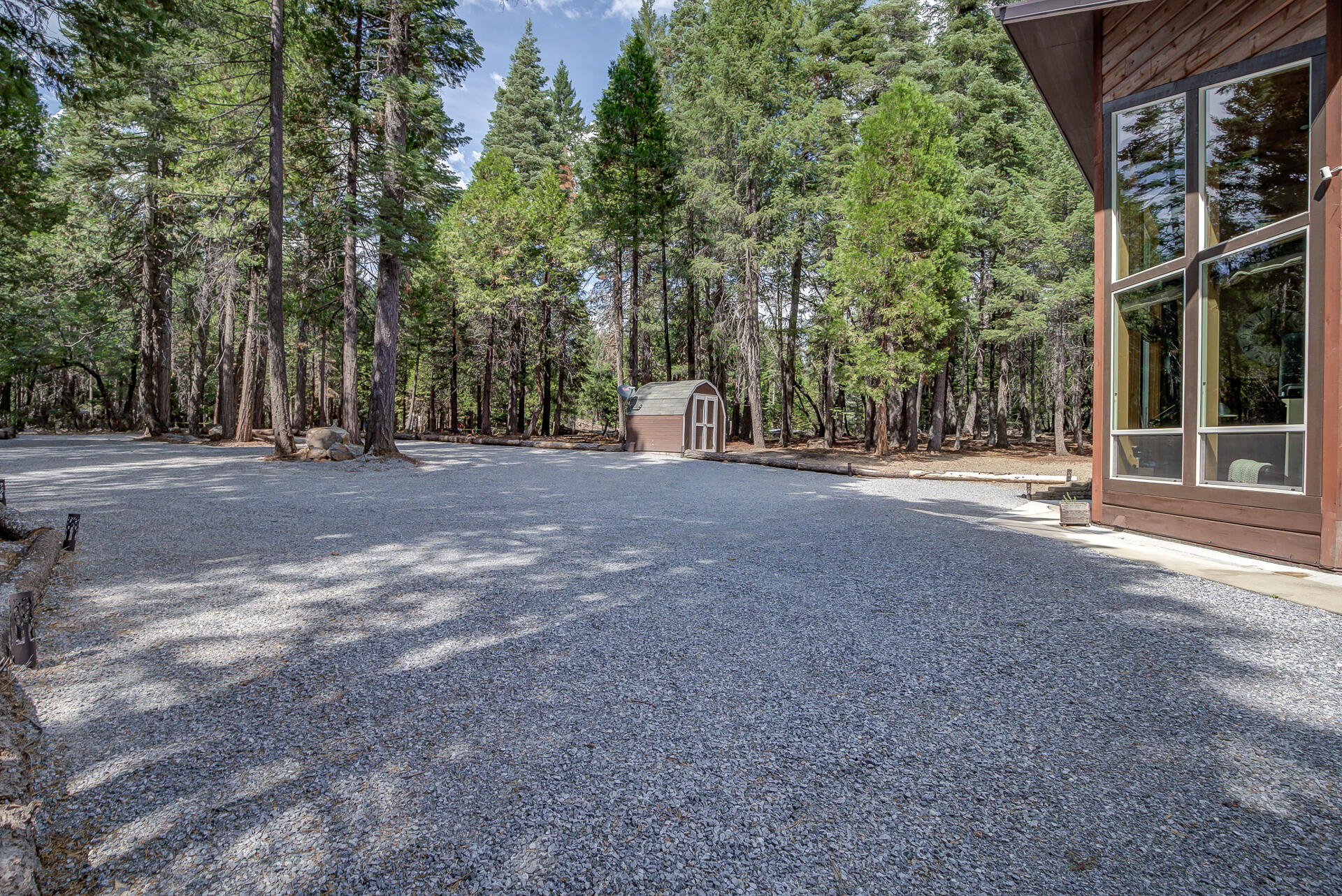 34607 Mountain Haven Road Shingletown, CA 96088 - Photo 56 of 63 a view of a house with large trees and plants