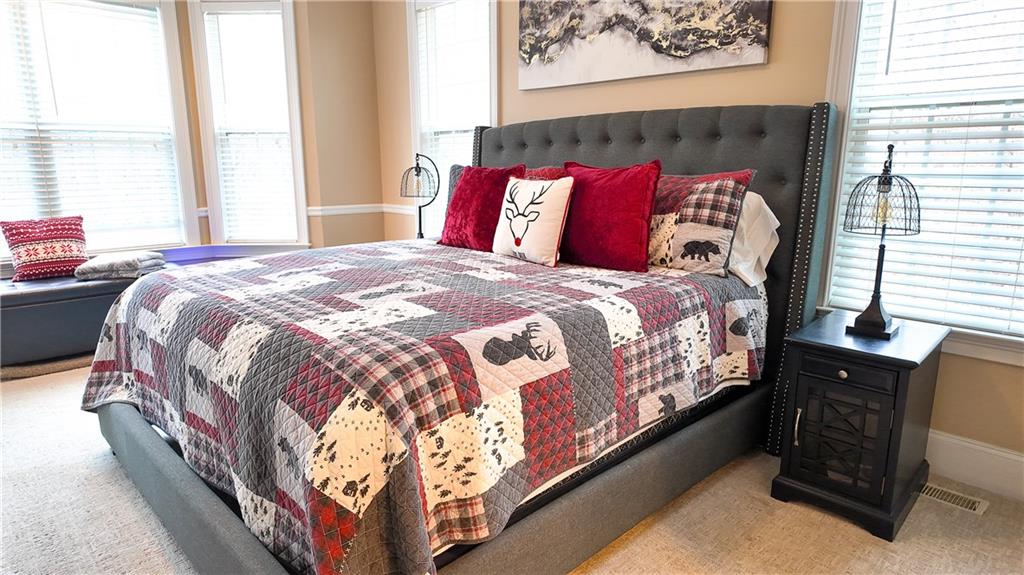 8179 Pineview Court Villa Rica, GA 30180 - Photo 19 of 38 a bed sitting in a bedroom next to a window